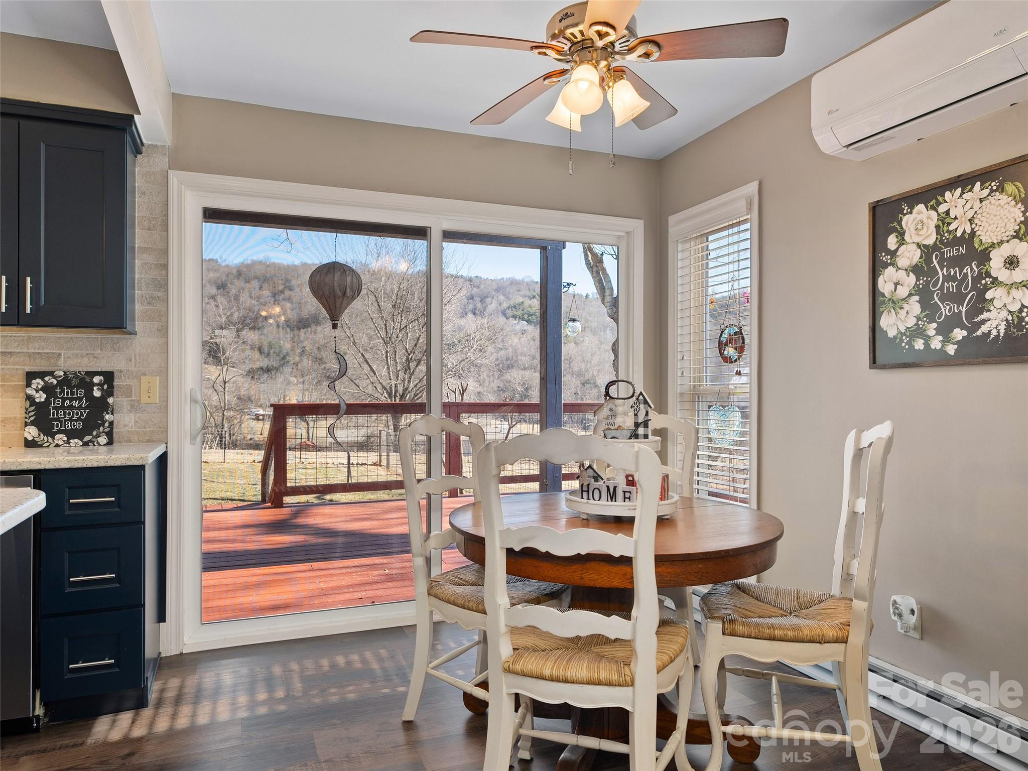 1672 Worley Cove Road Canton, NC 28716 - Photo 21 of 39 a view of a dining room with furniture wooden floor and chandelier