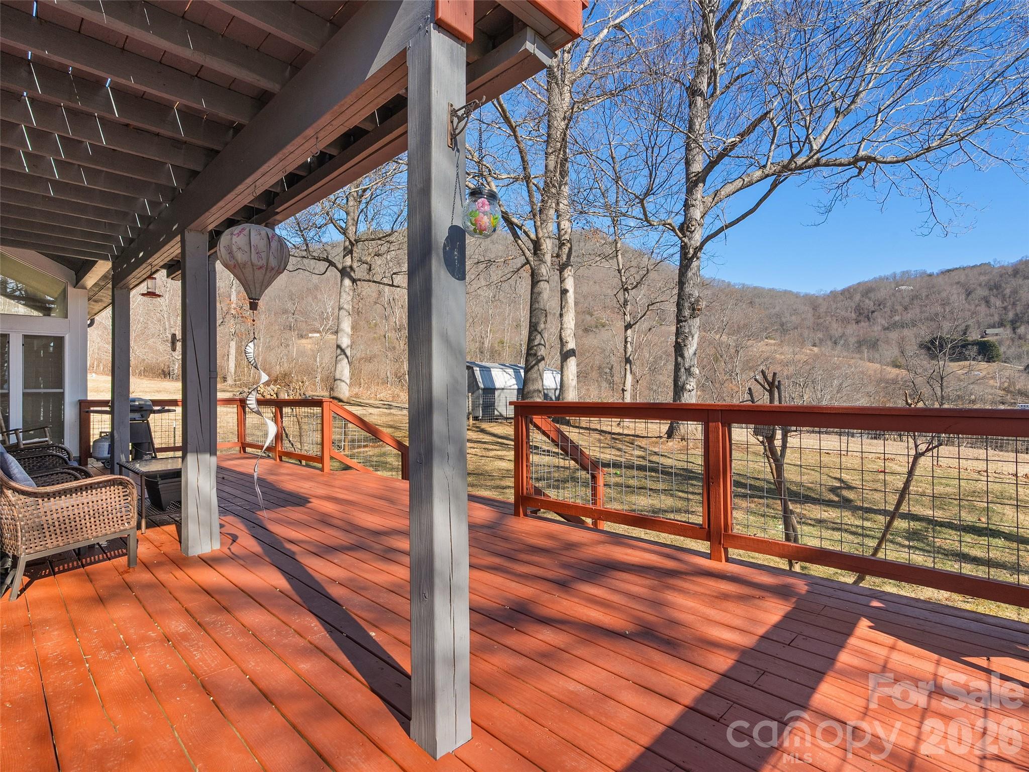 1672 Worley Cove Road Canton, NC 28716 - Photo 22 of 39 a view of a balcony with wooden floor