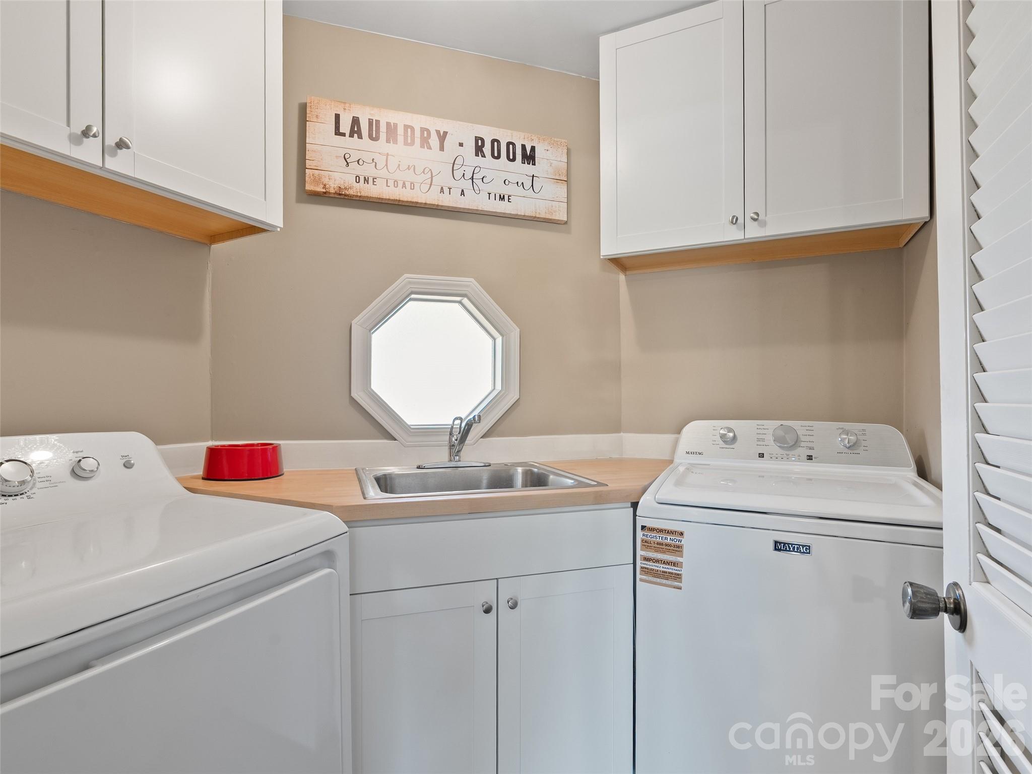 1672 Worley Cove Road Canton, NC 28716 - Photo 24 of 39 a utility room with dryer and washer
