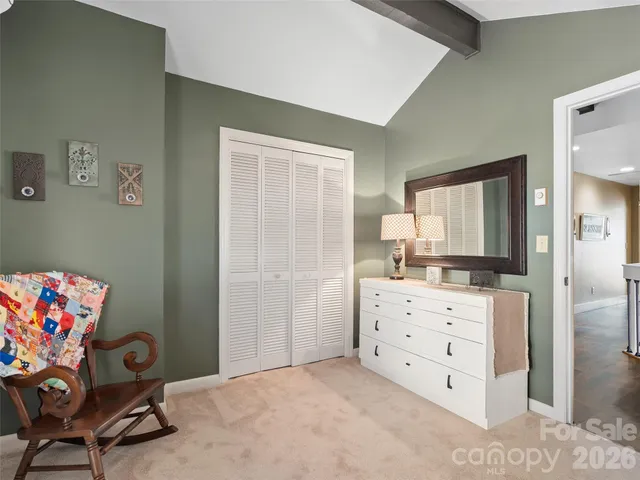 a room with furniture and a dresser