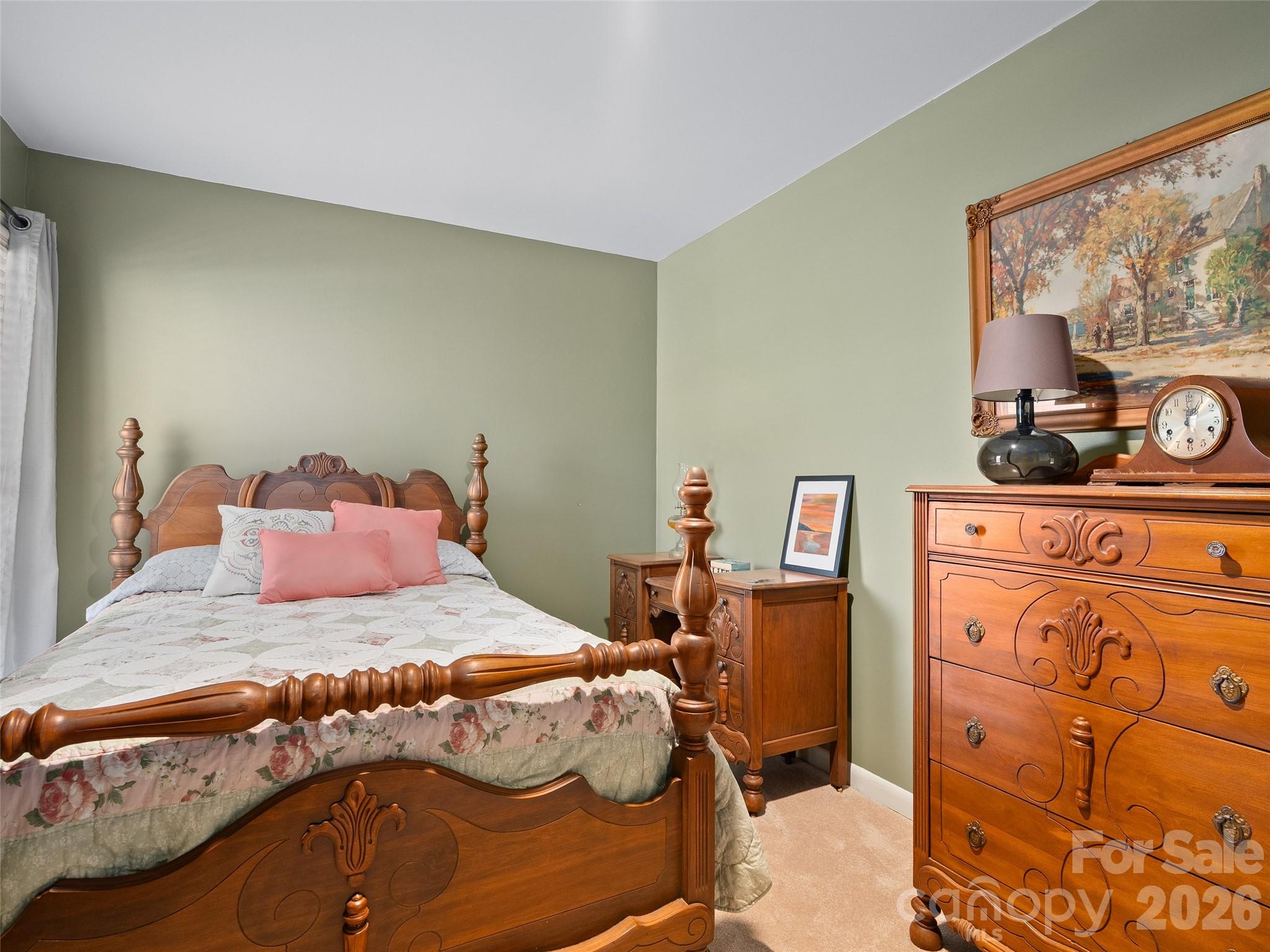 1672 Worley Cove Road Canton, NC 28716 - Photo 27 of 39 a bedroom with a bed and wooden floor