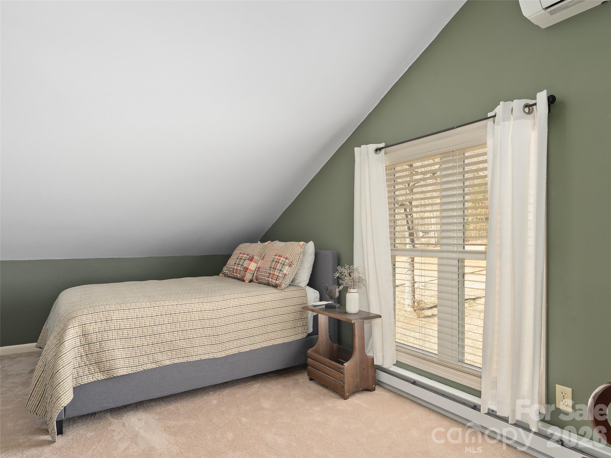 1672 Worley Cove Road Canton, NC 28716 - Photo 28 of 39 a bedroom with a bed and window