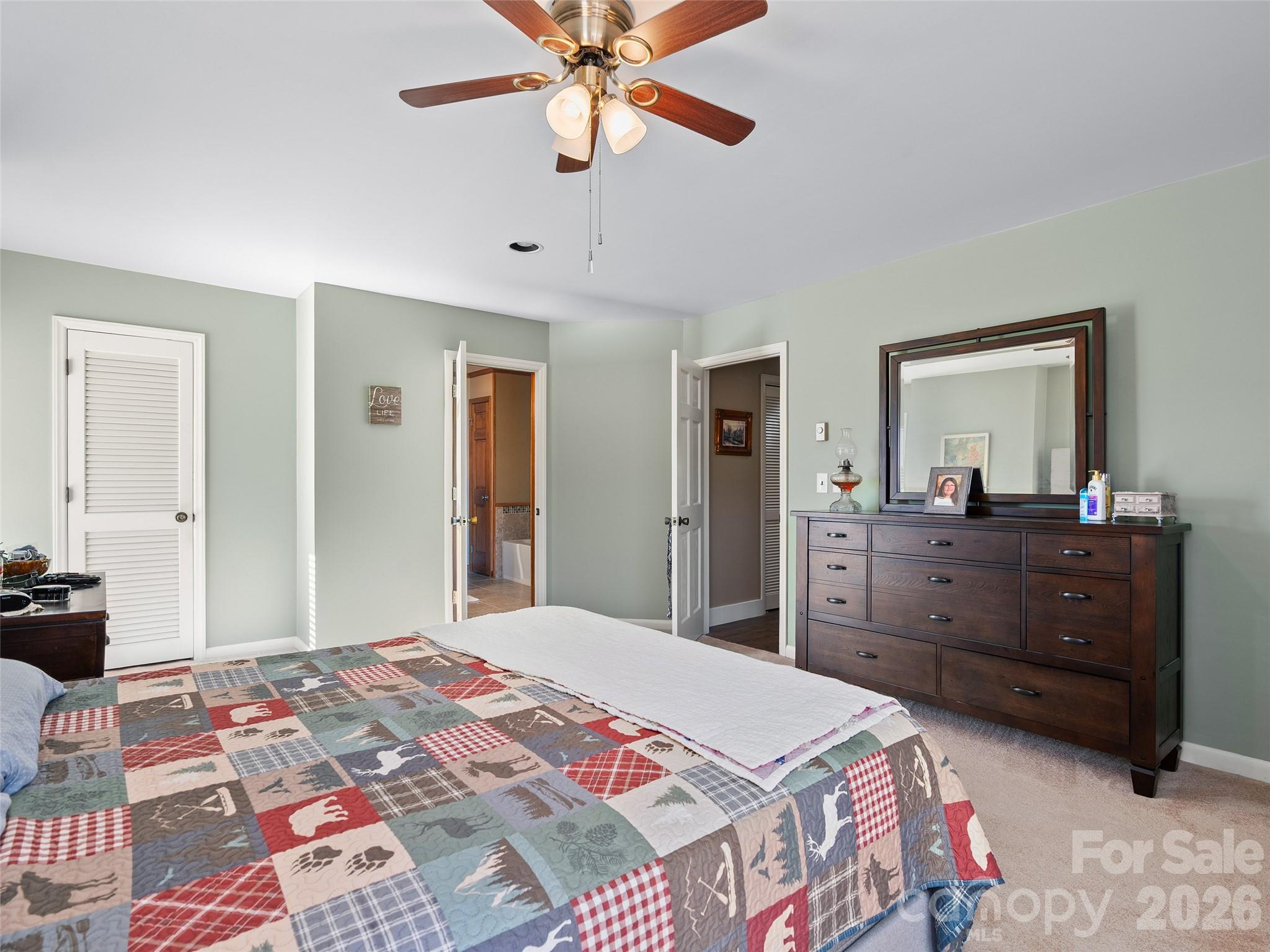 1672 Worley Cove Road Canton, NC 28716 - Photo 31 of 39 a bedroom with a bed and a dresser