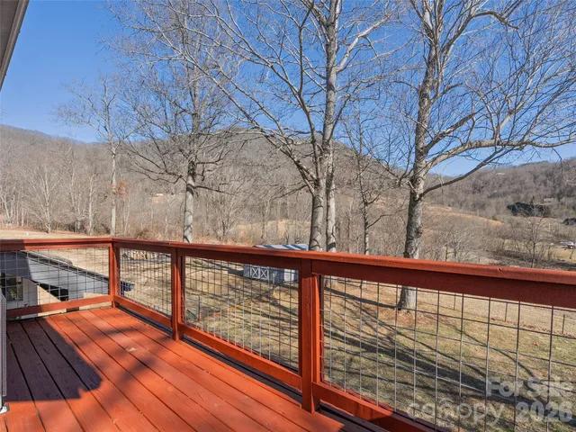 a view of balcony with wooden floor
