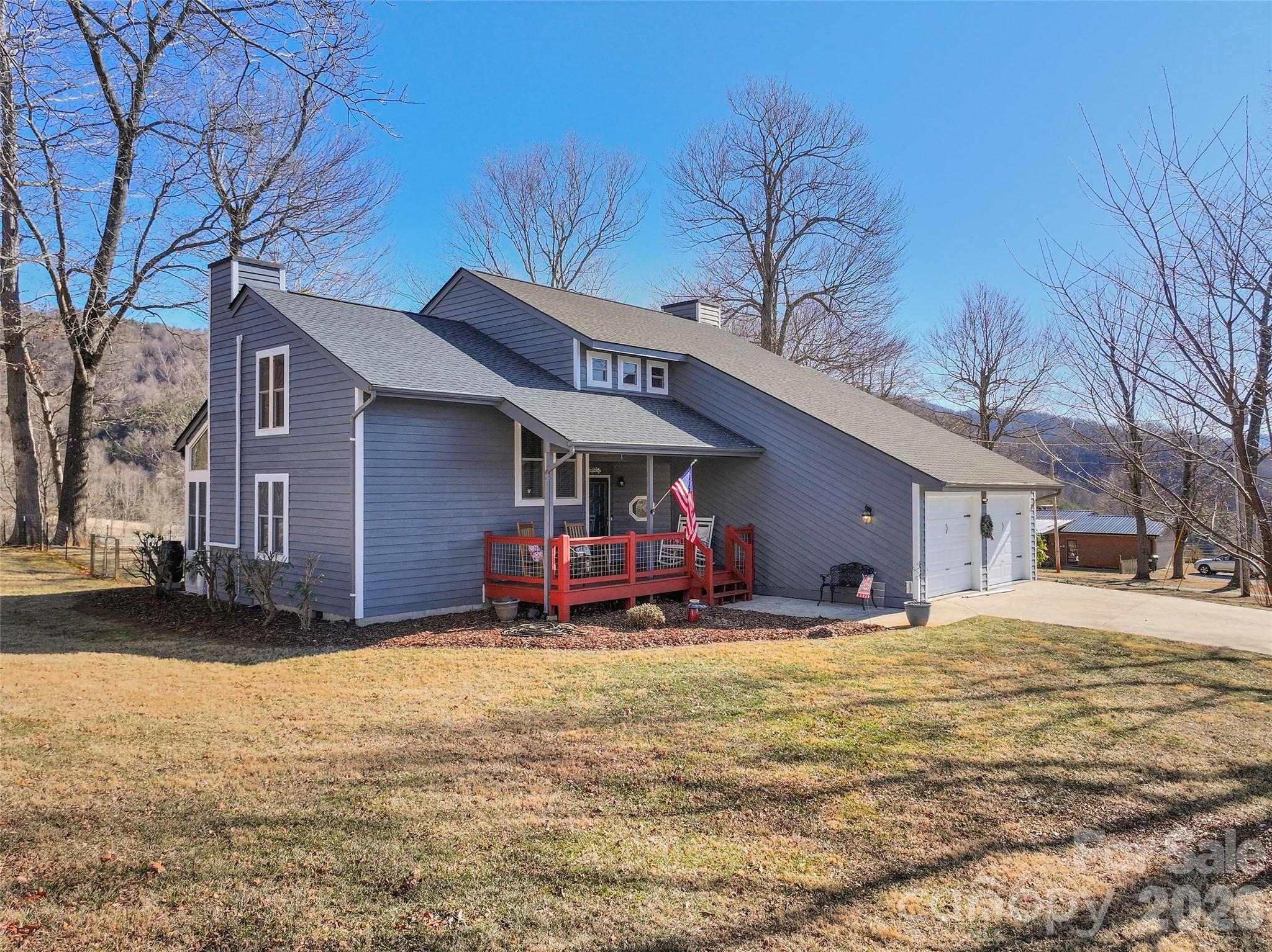1672 Worley Cove Road Canton, NC 28716 - Photo 4 of 39 a view of a house with a yard covered in snow