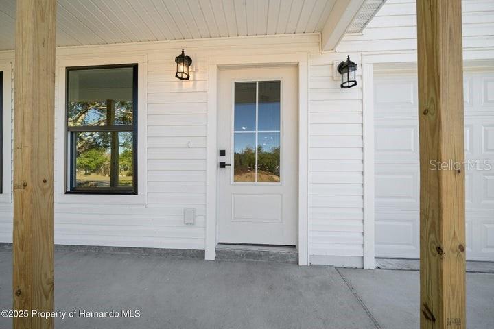 9002 Nakoma Way Weeki Wachee, FL 34613 - Photo 4 of 15 front view of a house