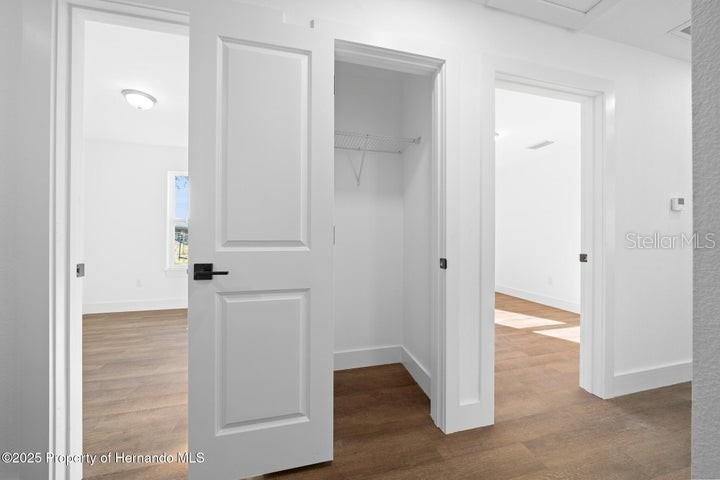 9002 Nakoma Way Weeki Wachee, FL 34613 - Photo 10 of 15 an empty room with wooden floor