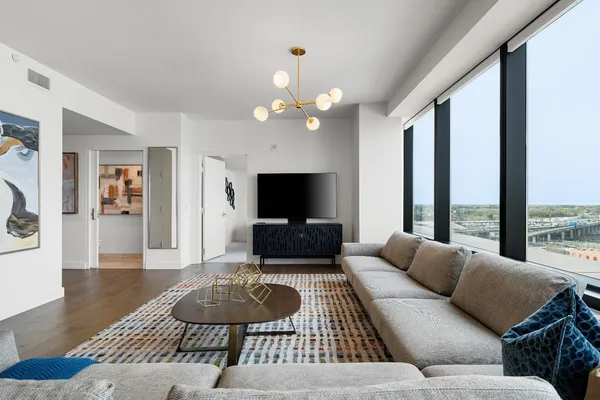 a living room with furniture and a flat screen tv
