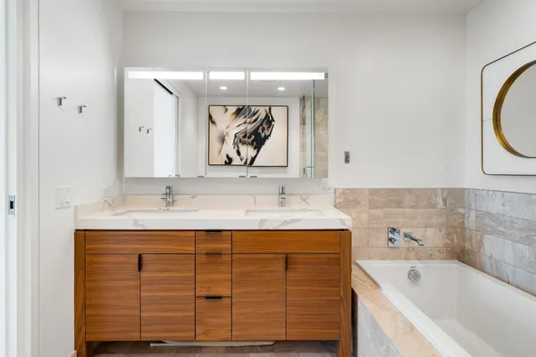 a bathroom with a toilet sink and shower