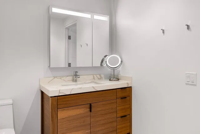 a living room with fireplace furniture and a chandelier