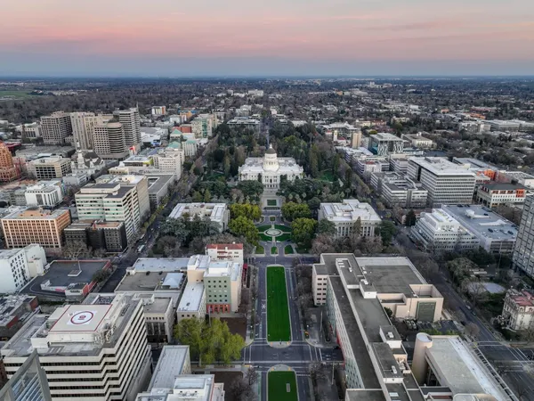 a dining room with furniture and a window