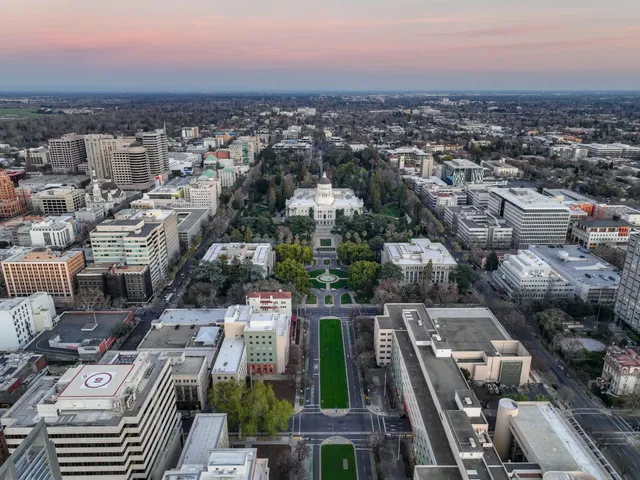a dining room with furniture and a window