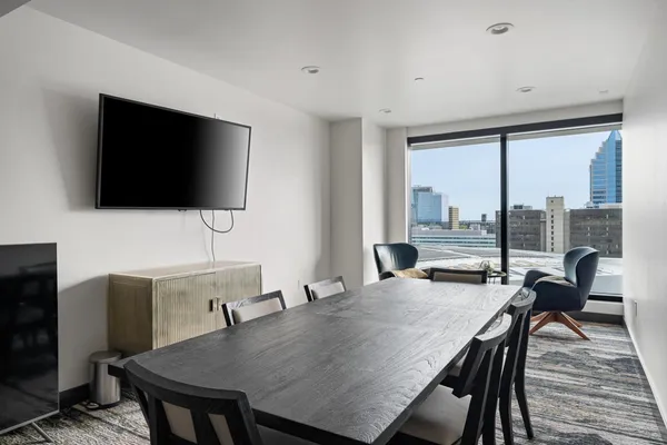 a view of a dining room with furniture window and wooden floor
