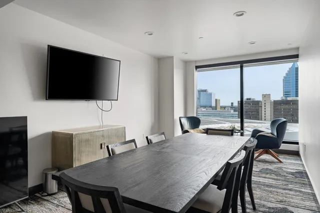 a view of a dining room with furniture window and wooden floor