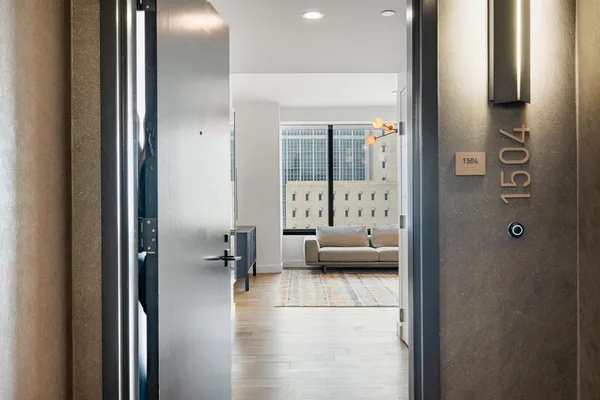 a living room with furniture and a large window