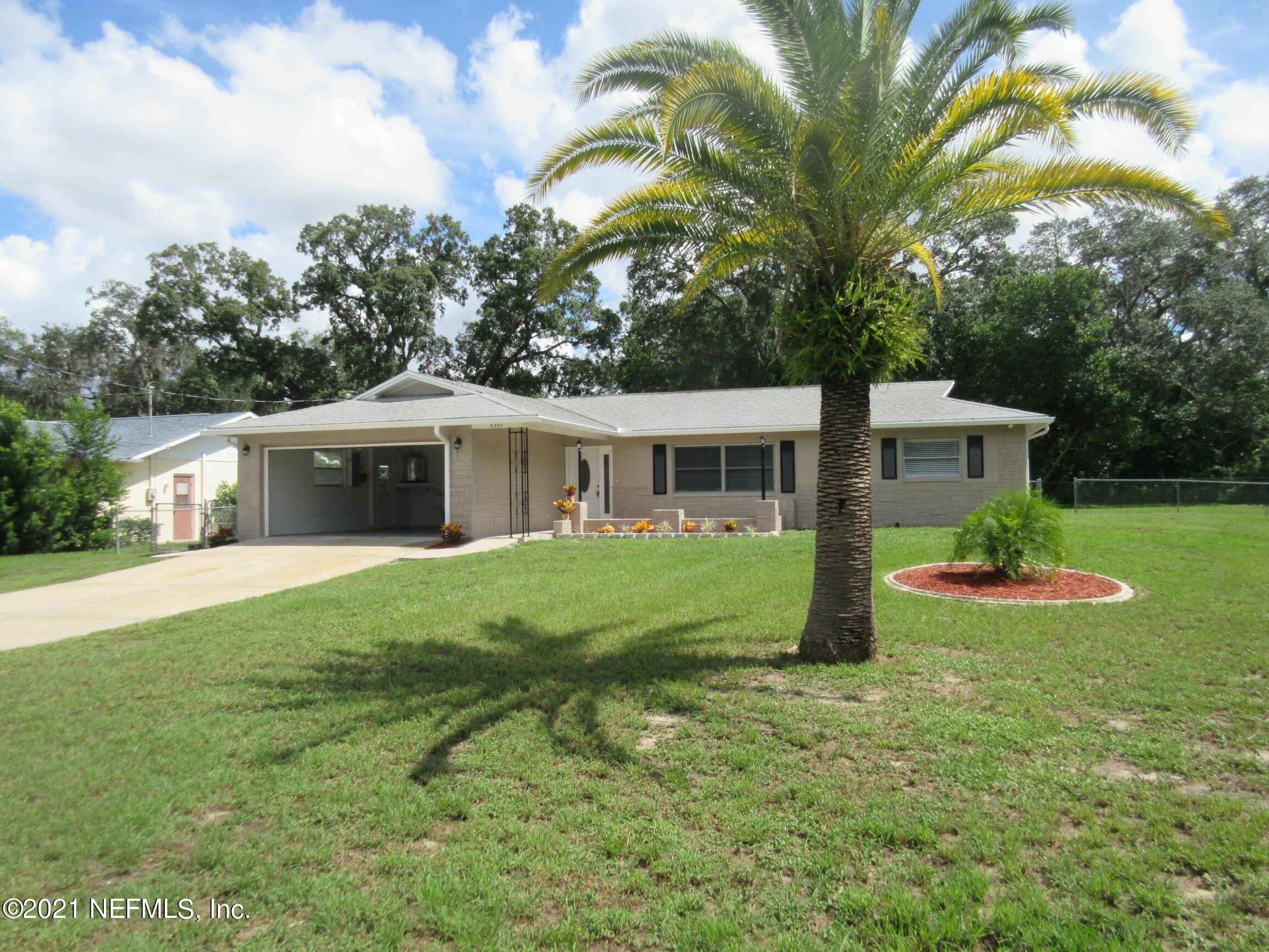 6331 Newmark Street Spring Hill, FL 34606 - Photo 3 of 24 Greg-Forster-12-31-2021_Page_08_Image_00