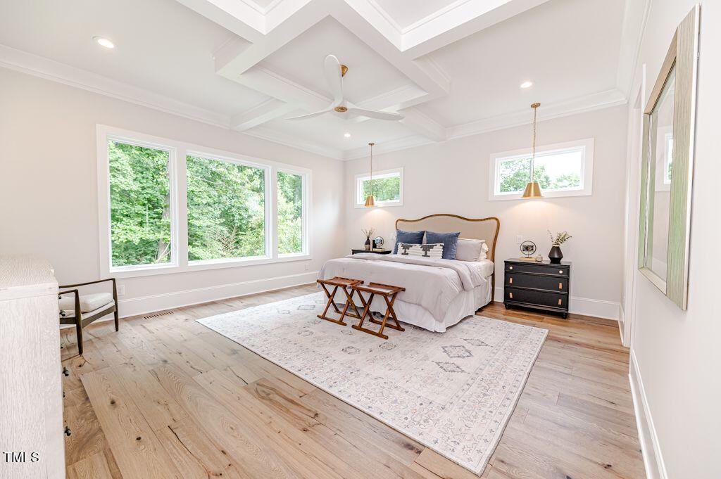 2101 Gresham Lake Road Raleigh, NC 27615 - Photo 14 of 48 a bedroom with a large bed and a window
