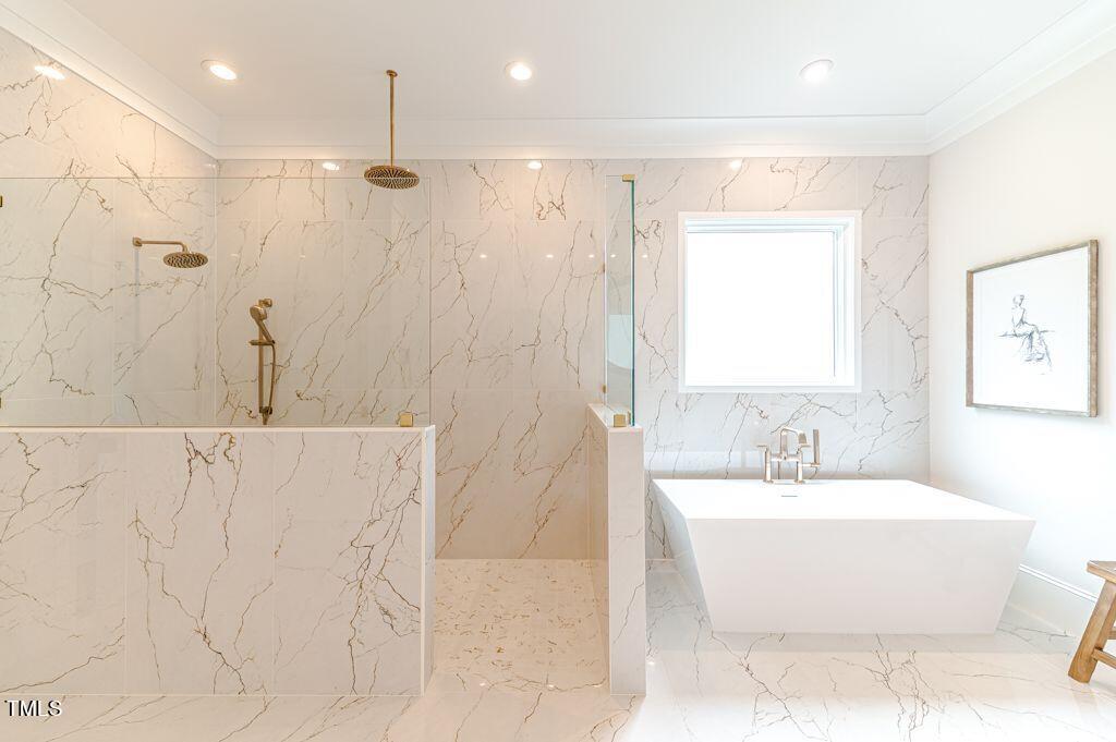 2101 Gresham Lake Road Raleigh, NC 27615 - Photo 18 of 48 a bathroom with a bathtub and a sink