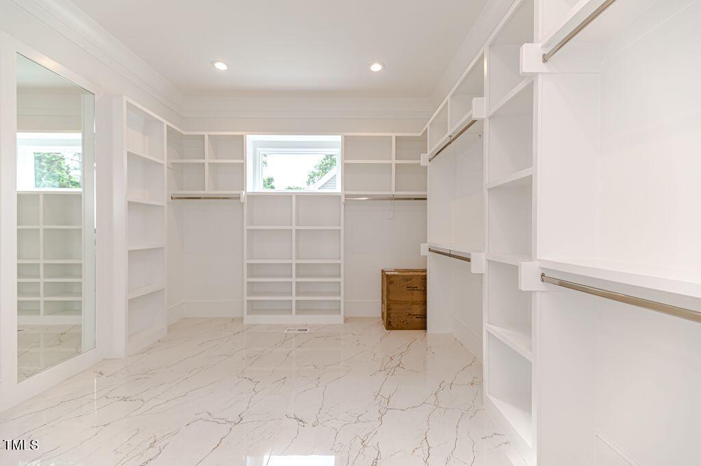 2101 Gresham Lake Road Raleigh, NC 27615 - Photo 19 of 48 an empty room with shelves