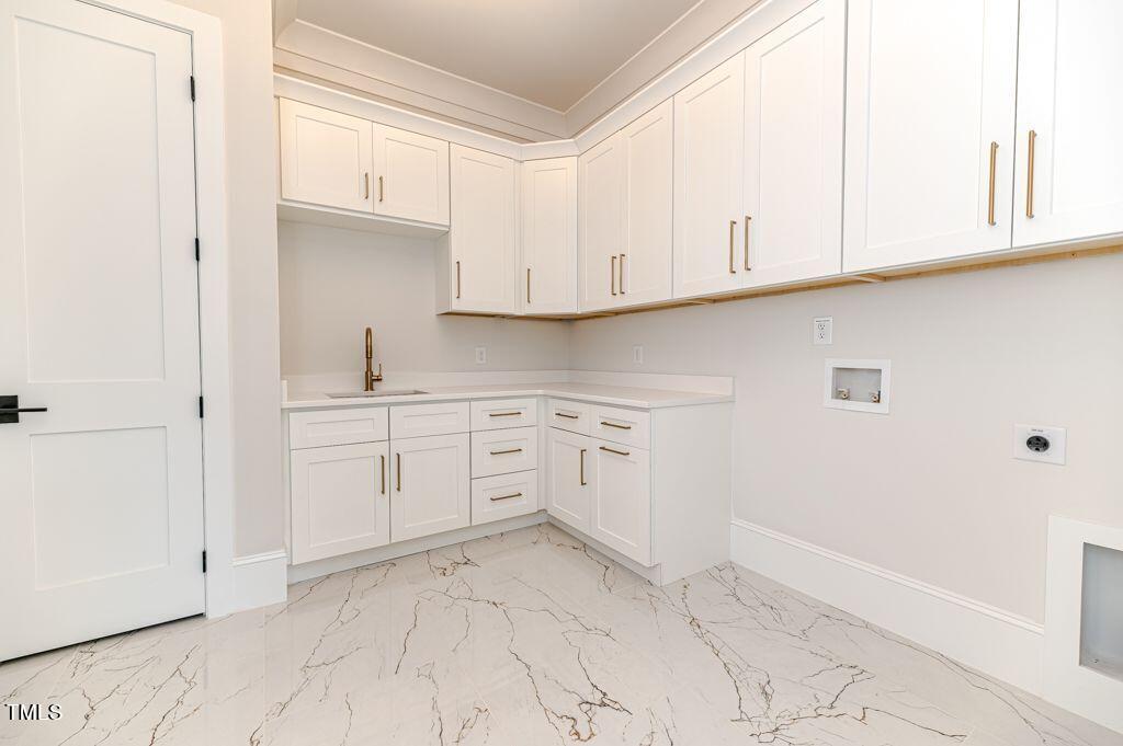 2101 Gresham Lake Road Raleigh, NC 27615 - Photo 20 of 48 a kitchen with white cabinets and white appliances