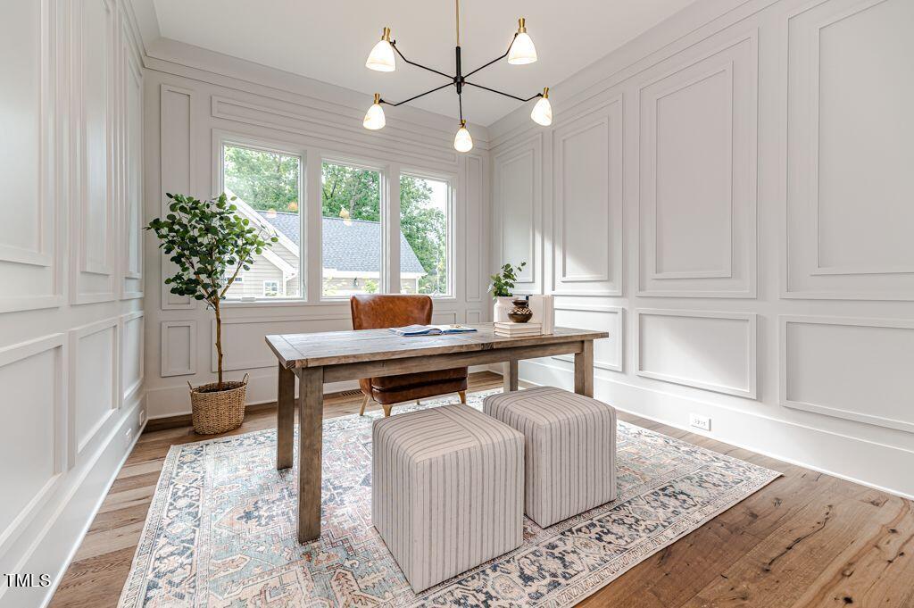 2101 Gresham Lake Road Raleigh, NC 27615 - Photo 21 of 48 a living room with a table and a potted plant