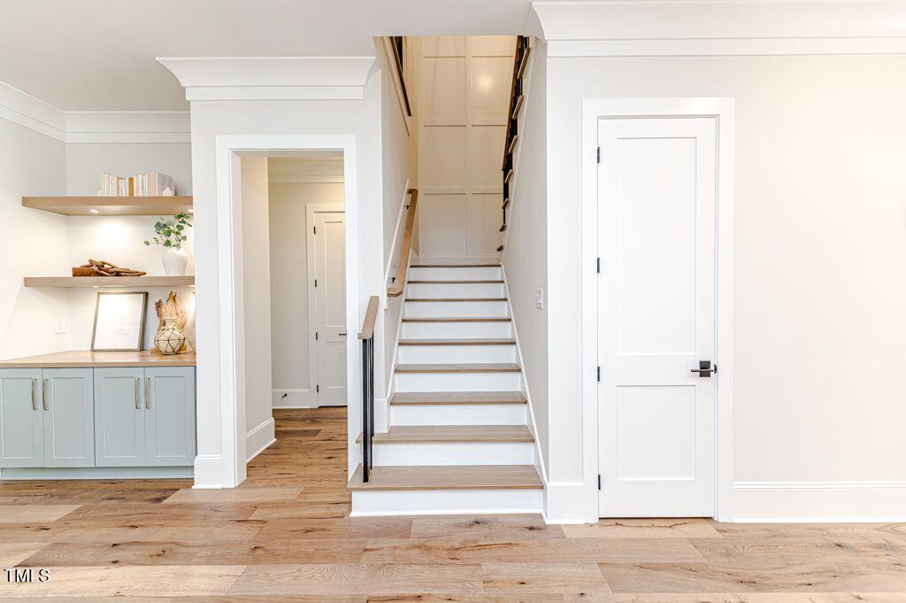 2101 Gresham Lake Road Raleigh, NC 27615 - Photo 28 of 48 a view of a hallway with wooden floor and entryway