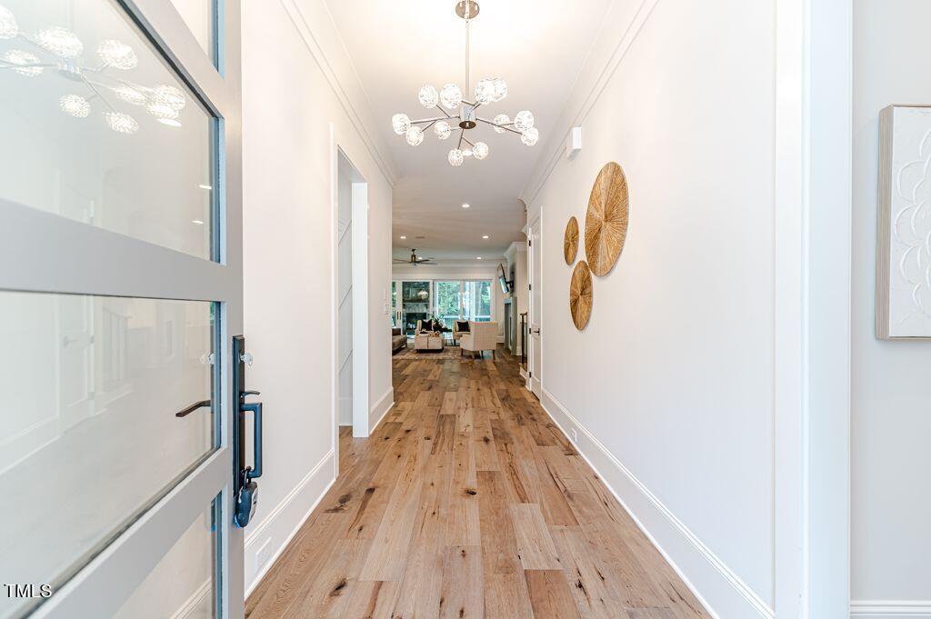 2101 Gresham Lake Road Raleigh, NC 27615 - Photo 3 of 48 a view of a room with wooden floor