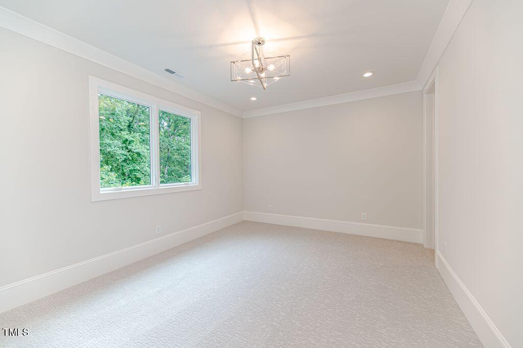 2101 Gresham Lake Road Raleigh, NC 27615 - Photo 31 of 48 an empty room with a window