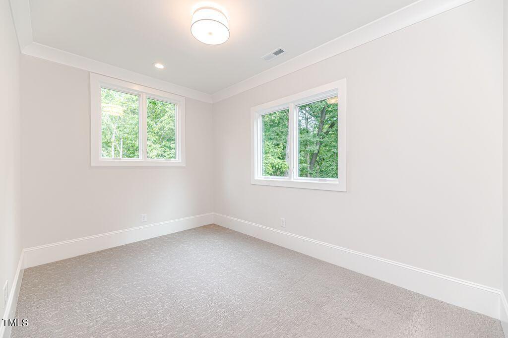 2101 Gresham Lake Road Raleigh, NC 27615 - Photo 33 of 48 an empty room with windows