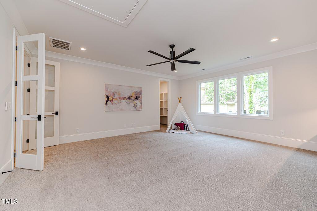2101 Gresham Lake Road Raleigh, NC 27615 - Photo 34 of 48 an empty room with windows and fan