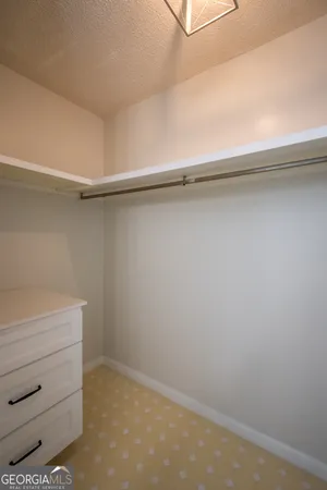 a view of a room with wooden floor and window