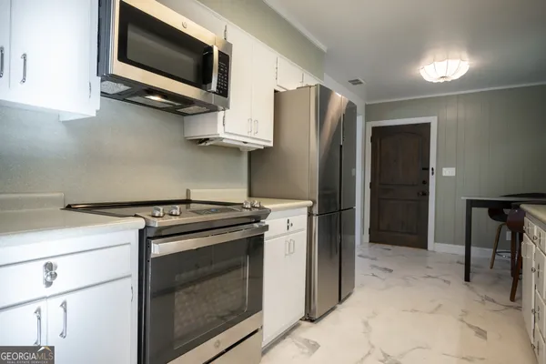 a view of storage and utility room with washer and dryer