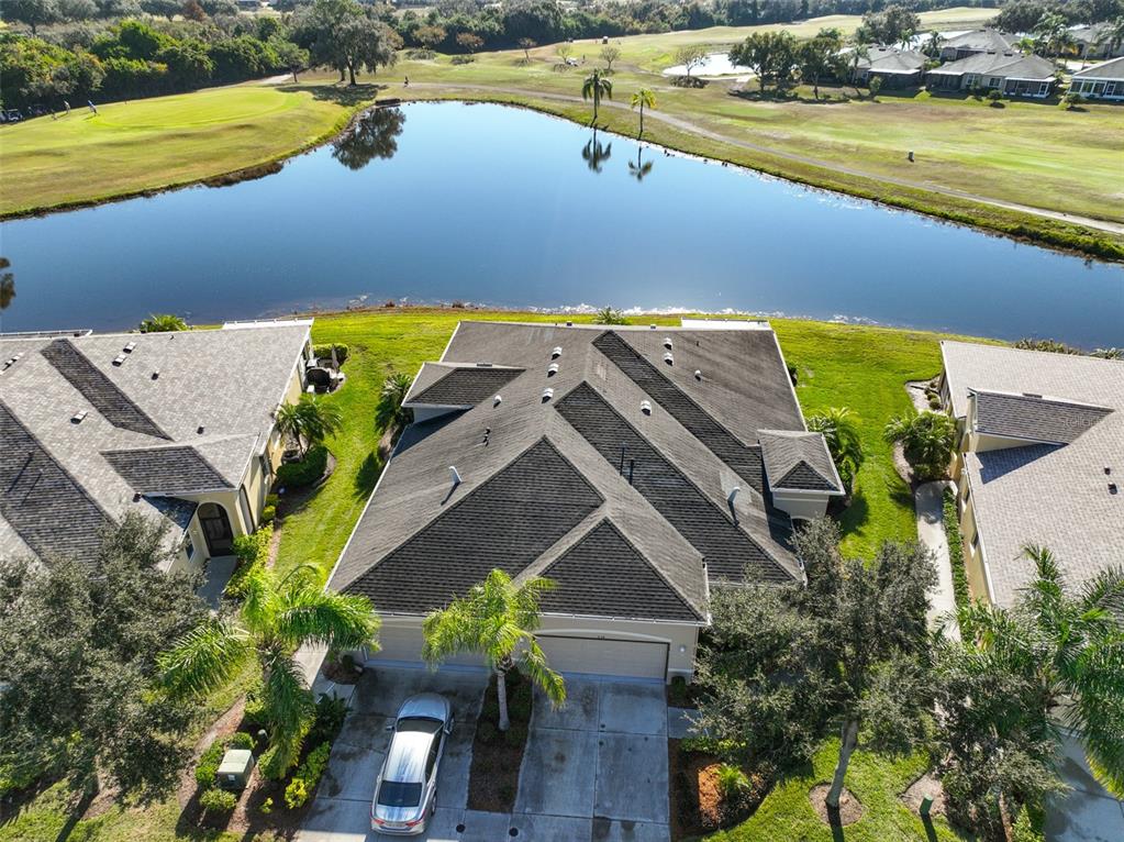 964 Pembroke Point Way Sun City Center, FL 33573 - Photo 2 of 66 an aerial view of a house with a lake view