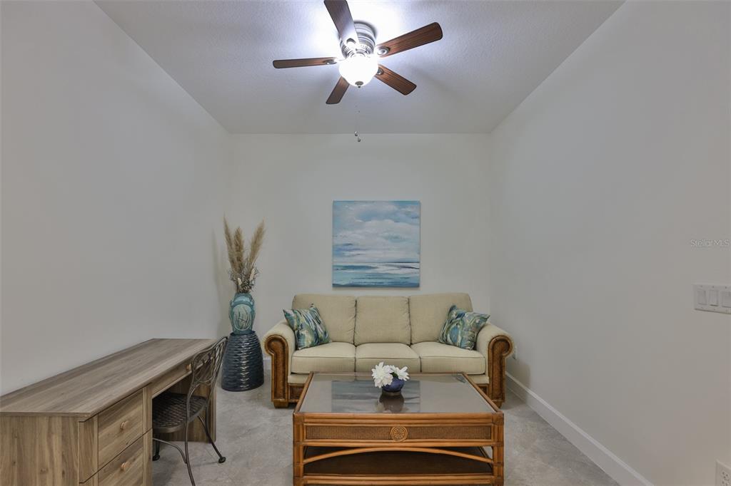 964 Pembroke Point Way Sun City Center, FL 33573 - Photo 24 of 66 a living room with furniture and a ceiling fan
