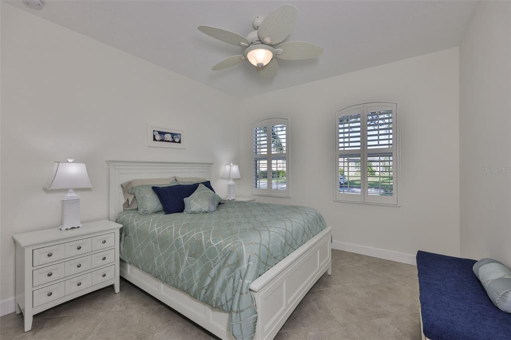 964 Pembroke Point Way Sun City Center, FL 33573 - Photo 34 of 66 a bedroom with a bed and a window
