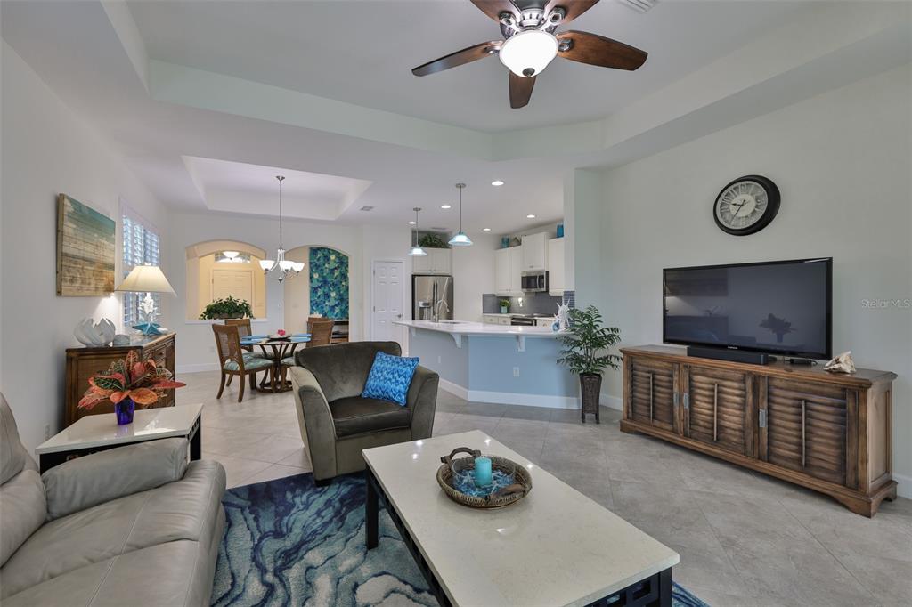 964 Pembroke Point Way Sun City Center, FL 33573 - Photo 10 of 66 a living room with furniture and a flat screen tv
