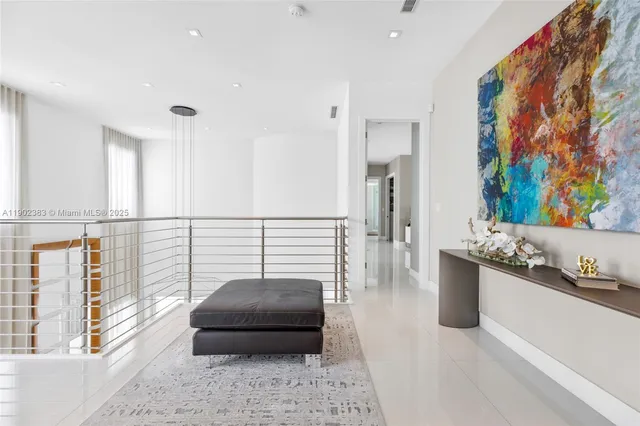 a bedroom with bed and flat screen tv