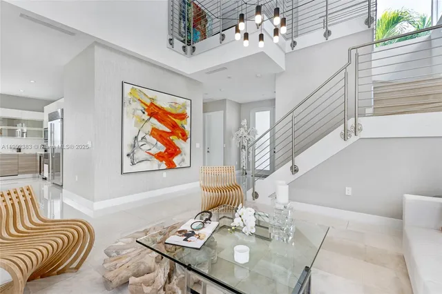 a view of a dining room with furniture wooden floor and chandelier