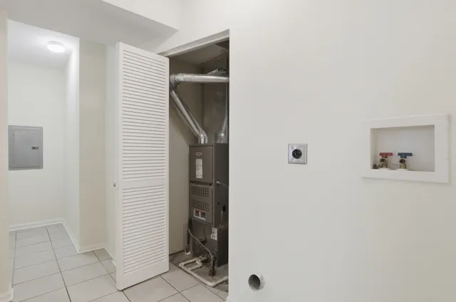 a view of hallway with bathroom