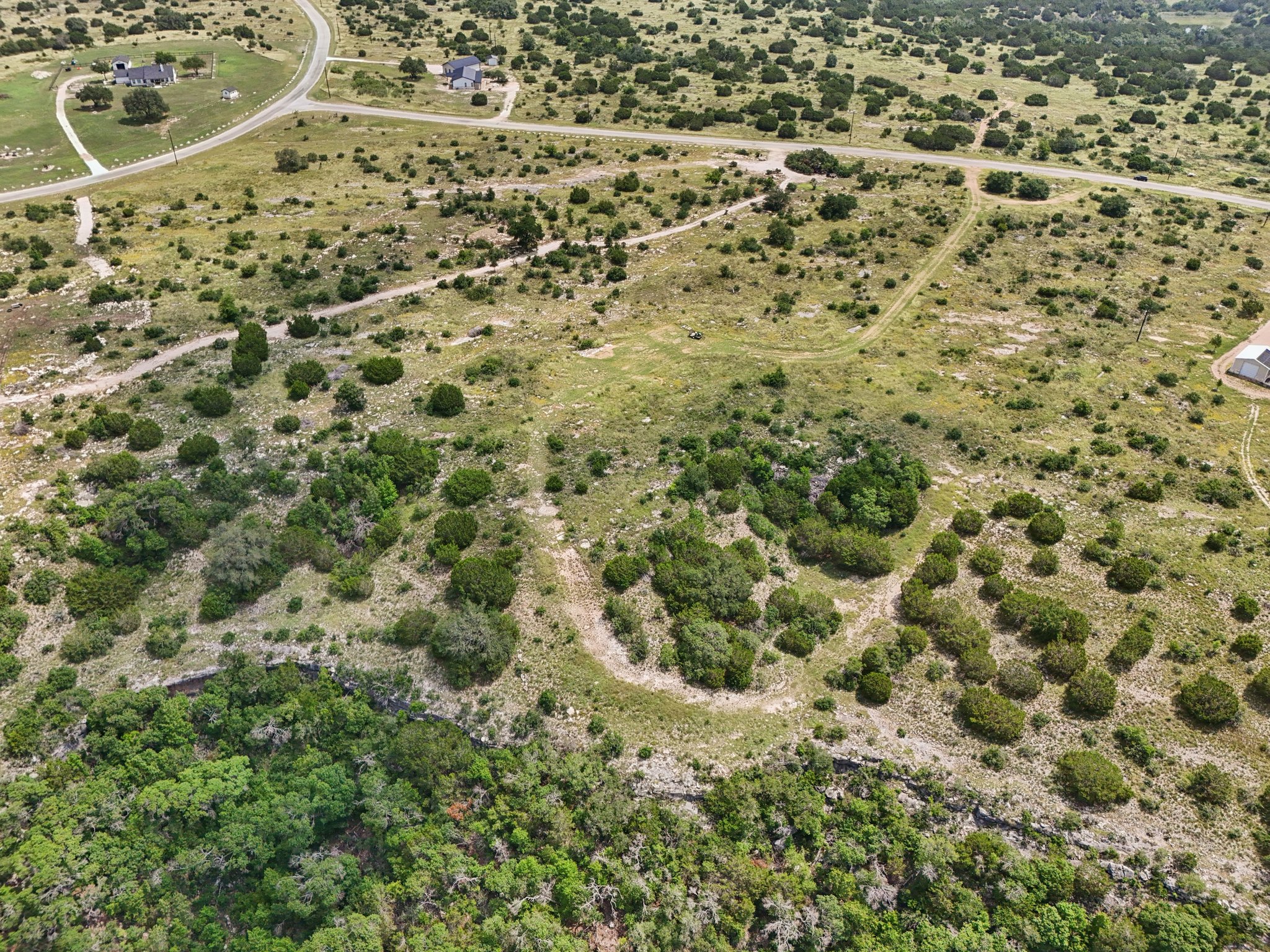 144 Cherokee Ridge Bertram, TX 78605 - Photo 17 of 32 Aerial view of property and surrounding area featuring rural landscape