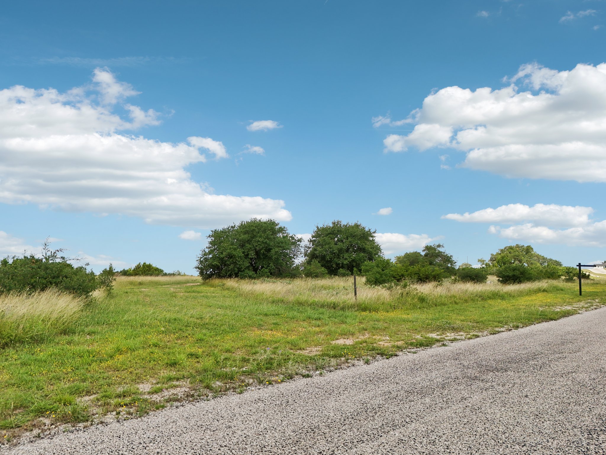 144 Cherokee Ridge Bertram, TX 78605 - Photo 18 of 32 View of asphalt road featuring a view of countryside
