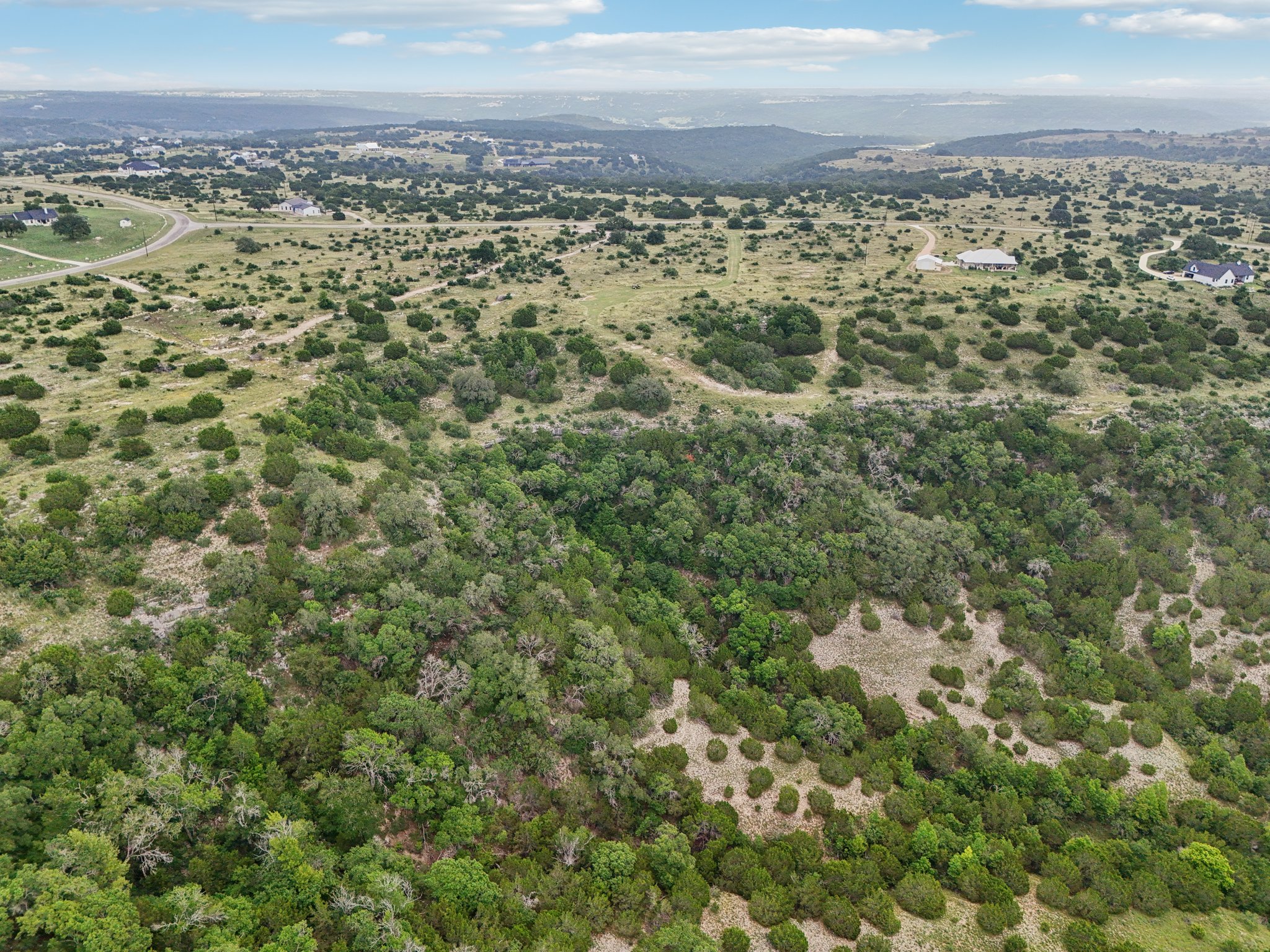 144 Cherokee Ridge Bertram, TX 78605 - Photo 4 of 32 Drone / aerial view of mountains