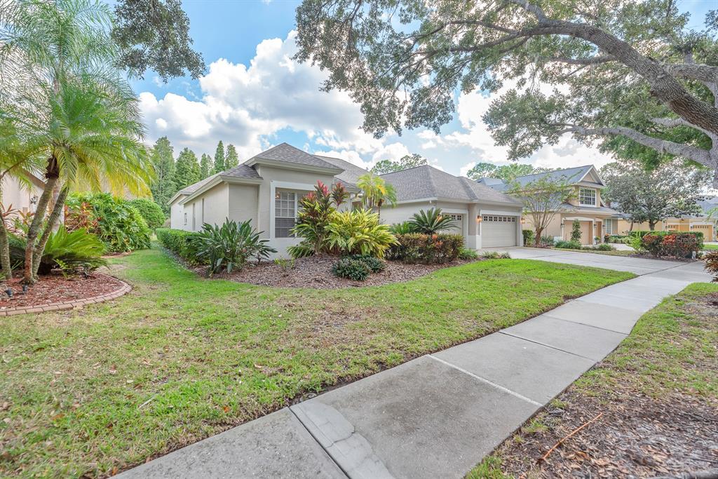 3504 Old Course Lane Valrico, FL 33596 - Photo 3 of 59 a front view of a house with garden