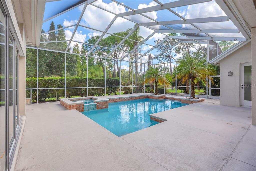 3504 Old Course Lane Valrico, FL 33596 - Photo 34 of 59 a view of a swimming pool with a patio and yard