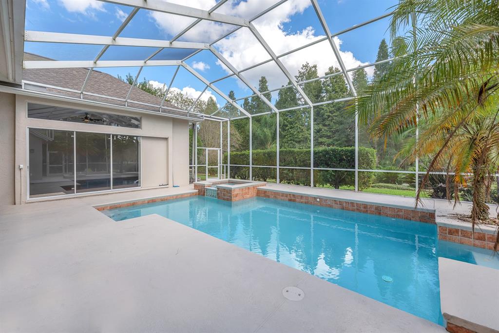 3504 Old Course Lane Valrico, FL 33596 - Photo 35 of 59 a view of a swimming pool with a large window