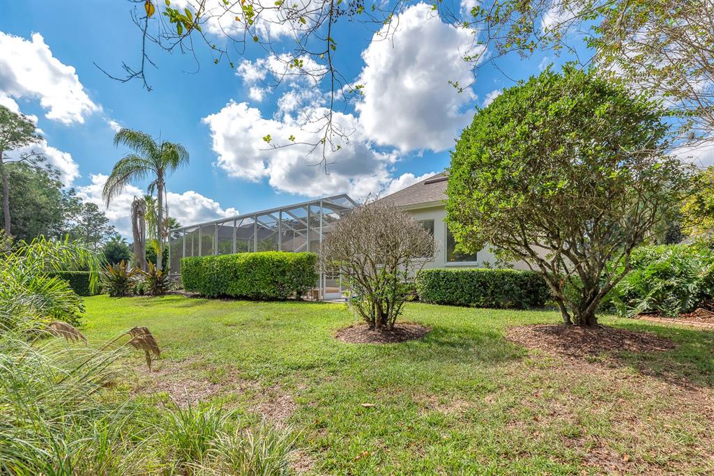 3504 Old Course Lane Valrico, FL 33596 - Photo 40 of 59 a view of a house with a big yard and large trees
