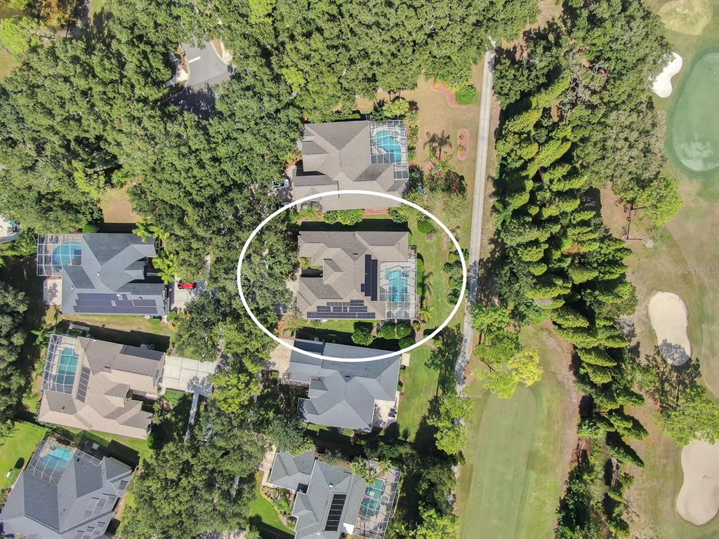 3504 Old Course Lane Valrico, FL 33596 - Photo 49 of 59 an aerial view of a house with a garden