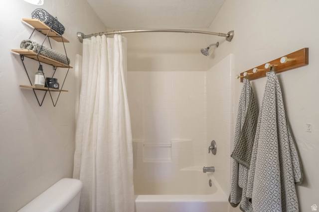1504 Rome Way Apple Valley, UT 84737 - Photo 13 of 22 Tub/shower combination featuring a curved shower rod and brushed nickel fixtures