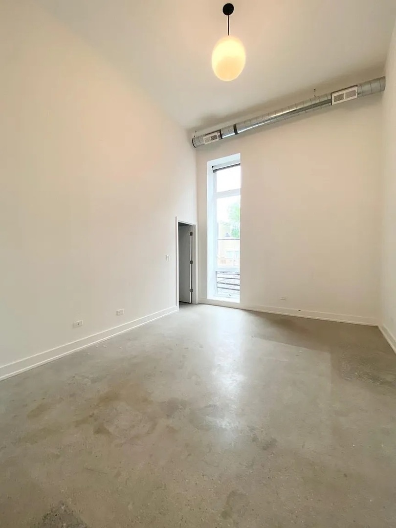Undisclosed Address Chicago, IL 60640 - Photo 13 of 16 a view of a room with a empty space