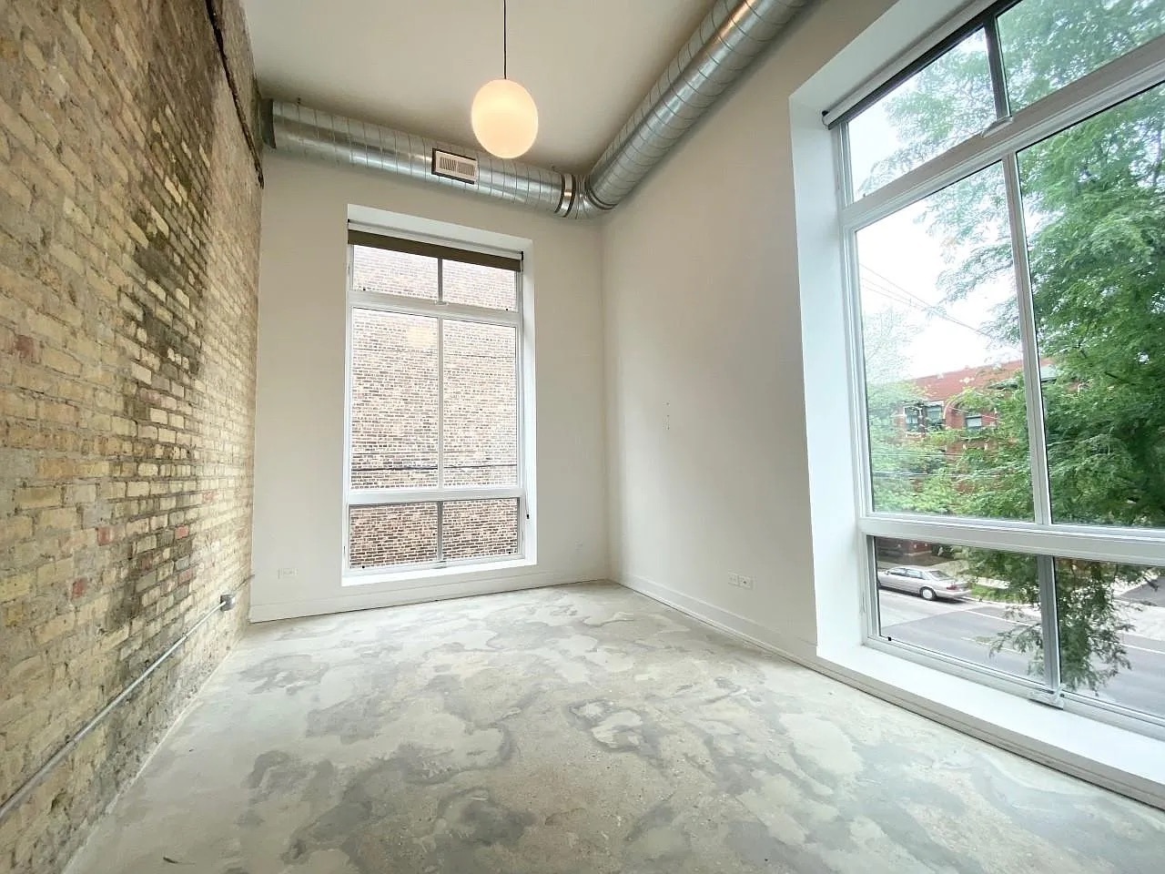 Undisclosed Address Chicago, IL 60640 - Photo 15 of 16 a view of an empty room with a window